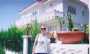 Oxana opposite her house